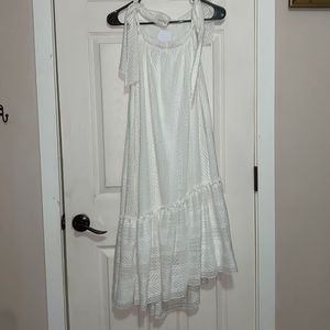 Mid length white dress, with adjustable straps.